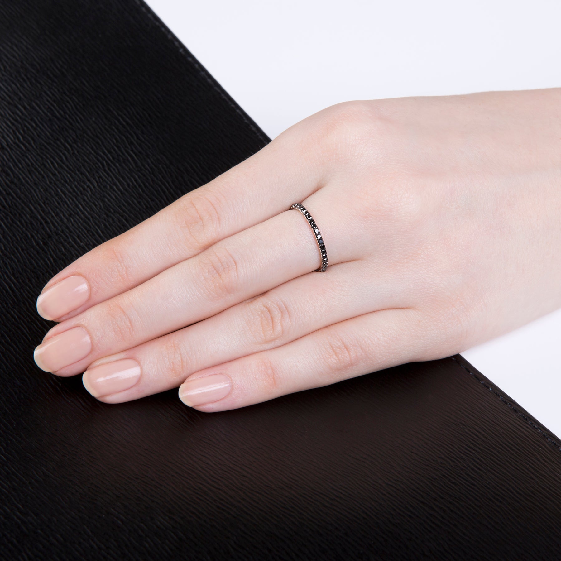 Image of Verifine black diamond ring with 18 carat white gold on a lady's hand